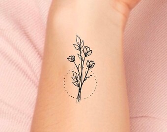 May include: A simple line drawing tattoo of a bouquet of flowers with a circle around it.