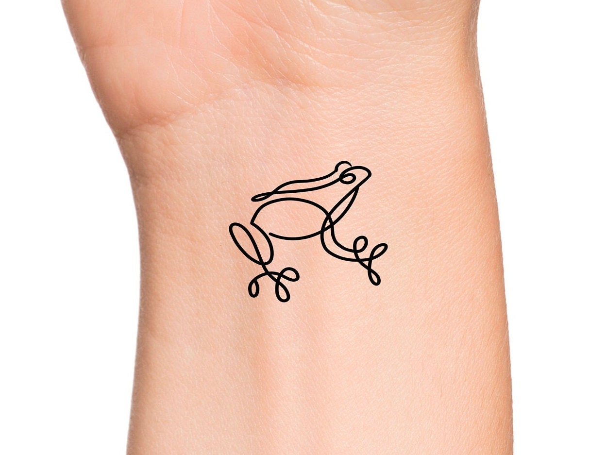Frog tattoo on the inner forearm