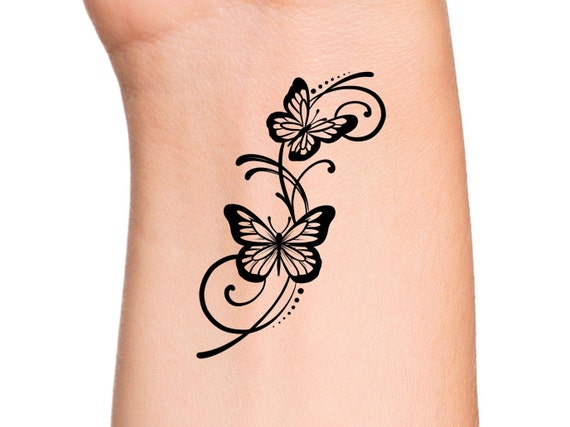 Butterfly with swirls tattoo designs