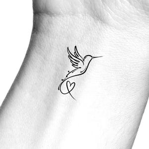 May include: A simple line drawing tattoo design of a hummingbird with a heart at the end of its tail.