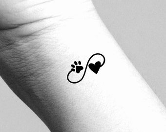 May include: Black infinity symbol tattoo design with a paw print and a heart.