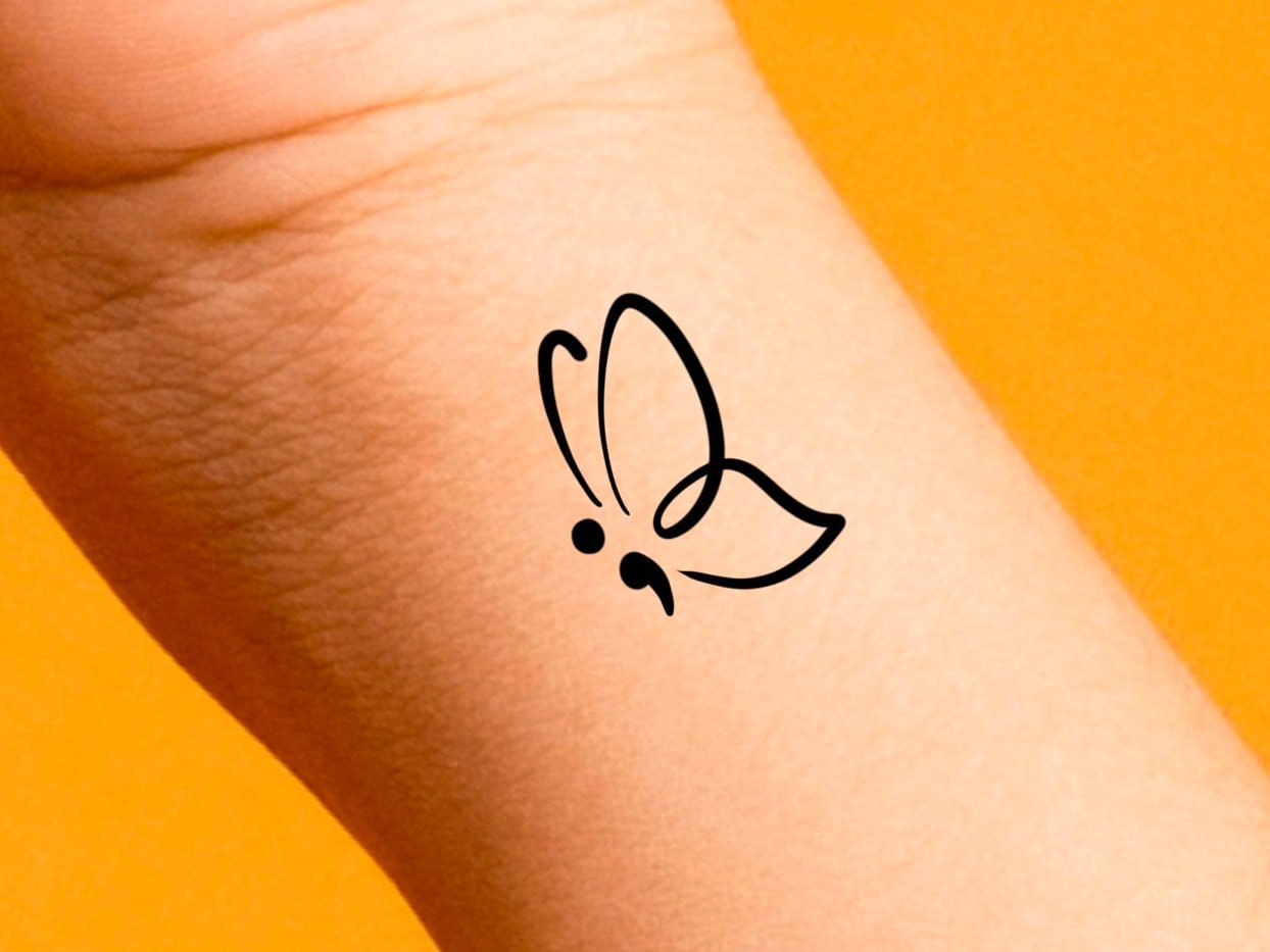 Tatuaggio Farfalla Punto E Virgola