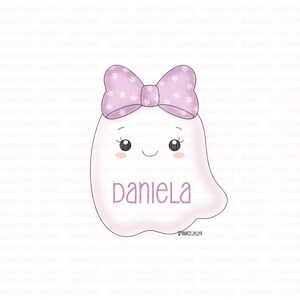 May include: A white ghost with a pink bow and a pink star pattern. The ghost has a smiling face with eyelashes and the name "Daniela" written below.