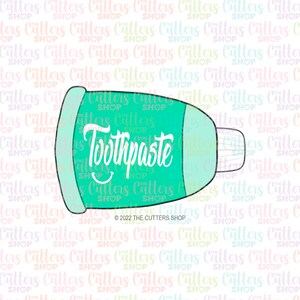 May include: A green and white cookie cutter shaped like a tube of toothpaste with the word "Toothpaste" written on it.