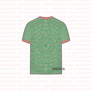 May include: A short-sleeved t-shirt in a muted green shade featuring a circular Aztec-inspired calendar design in a darker green tone. The shirt has a contrasting coral-colored trim on the crew neckline and sleeve cuffs. The text S4UC12026 is visible.