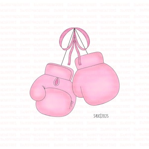 May include: A pair of pink boxing gloves, hanging from a pink ribbon bow. The gloves are a solid pink color and have a classic boxing glove shape. The image is set against a white background.