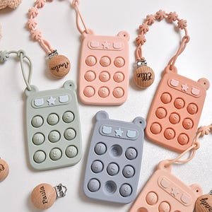 Juguete de silicona Pop It Phone y clip para chupete / Clip de sujeción de silicona / Clip de madera de haya / Juguete sensorial para bebés / Clip personalizado