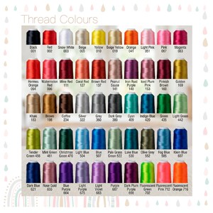 May include: A color chart titled Thread Colours displaying rows of embroidery thread spools in various shades including black, red, white, beige, yellow, orange, pink, magenta, brown, purple, green, blue, and grey with corresponding names and numbers.
