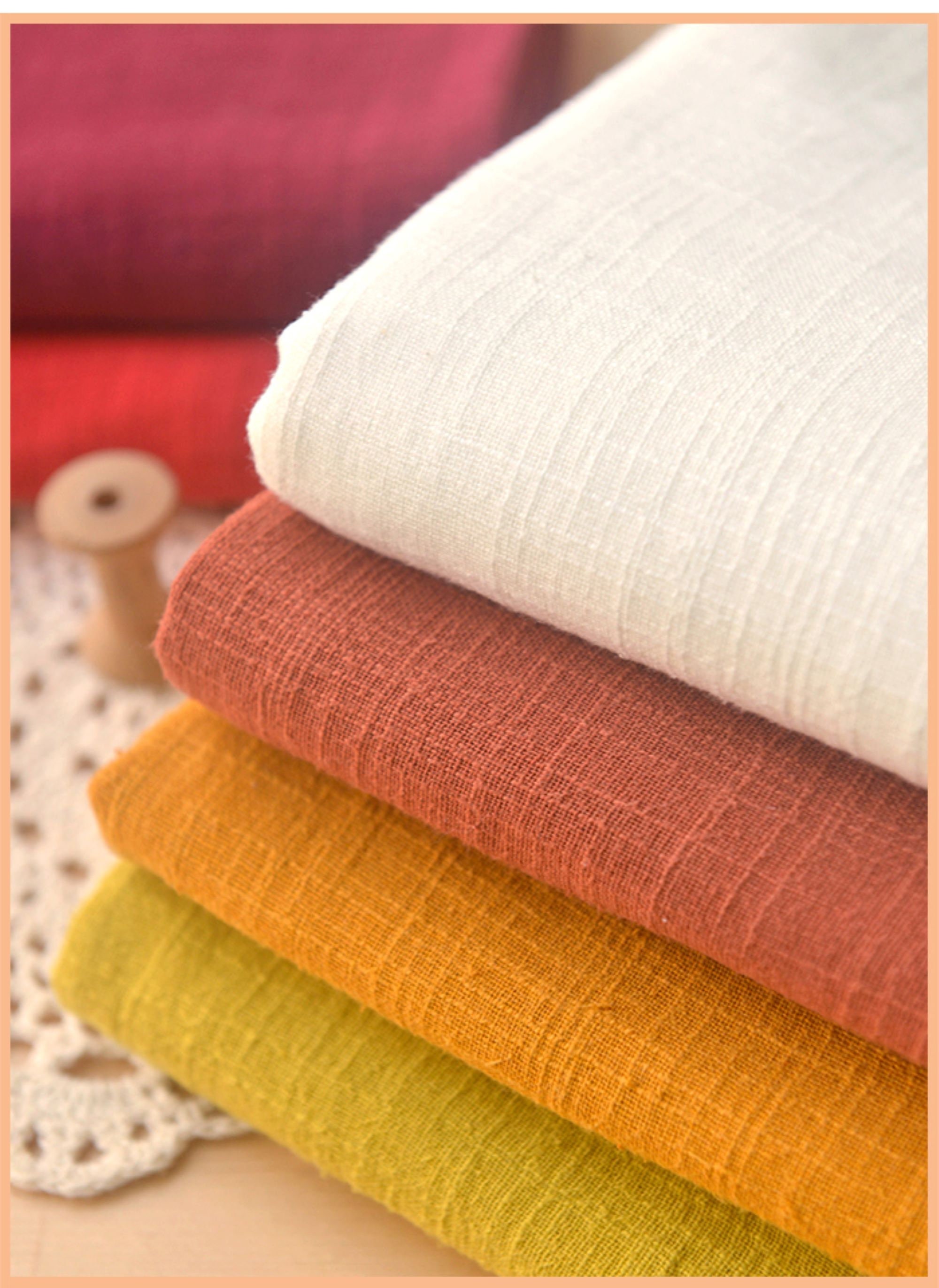 Premium Photo  Cotton fabric stacked in layers natural fabric for sewing  clothes and bed line