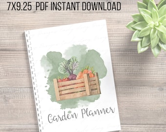 May include: Printable garden planner with a watercolor illustration of a wooden crate filled with fresh vegetables, including carrots, beets, and leafy greens. The text "Garden Planner" is printed on the cover.