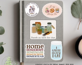 May include: A gray notebook with several homestead-themed stickers. Stickers include text that says "Printable Homestead Stickers", "Support Your Local Egg Dealer", "In my Granny Era", "There's an herb for that", "Home", and "I Garden Because I Can".