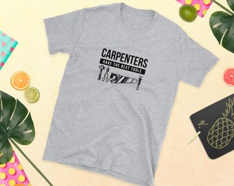 May include: A gray t-shirt with the text "CARPENTERS HAVE THE BEST TOOLS" and a graphic of various carpentry tools.