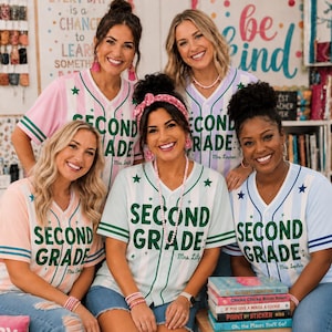 May include: Five short-sleeved button-down jerseys with vertical stripes in pastel colors, featuring the green text SECOND GRADE and a teacher's name. The jerseys have green or blue striped trim on the sleeves and collar, and small star accents.