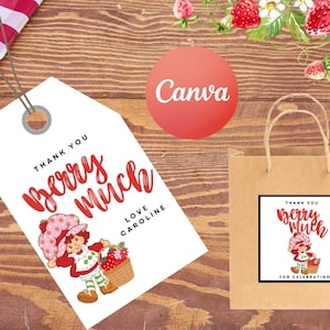 Può includere: Un'etichetta bianca e un sacchetto di carta marrone con un design "Thank You Berry Much" con un personaggio dei cartoni animati. L'etichetta e la borsa hanno un tema fragola, con uno sfondo in legno e illustrazioni di fragole.