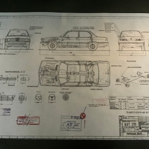 May include: A black and white technical drawing of a BMW 315 car. The drawing shows the car from different angles, including the front, side, and top views. The drawing also includes details of the car's engine and suspension. The drawing is labeled with the car's model number, "E21 315", and the date "79.287/7-ZV-00/4835/01".