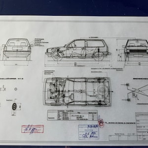 May include: A black and white technical drawing of a car with various dimensions and measurements labelled in German. The drawing includes a side view, front view, rear view, and a top view of the car. The drawing also includes a diagram of the car's braking system.