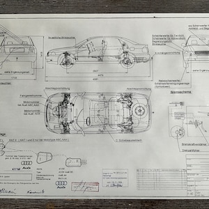 May include: A black and white technical drawing of an Audi car with measurements and details about the car's components. The drawing includes the car's dimensions, engine, and exhaust system. The drawing also includes the text "Audi AG" and "186.58771-1/7/1994".