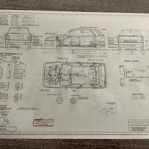May include: A black and white technical drawing of a Fiat Uno car. The drawing shows the car's exterior, interior, and engine compartment. The drawing also includes a diagram of the car's electrical system. The drawing is labeled with the car's model number, "Fiat Tipo 188-1400".