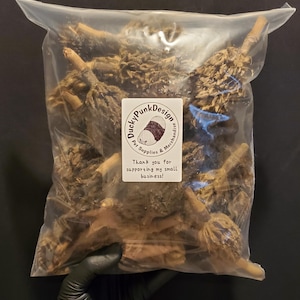 May include: A clear plastic bag filled with brown, dried pet treats. The bag has a white label with the text "Ducky Punk Design Pet Supplies & Merchandise" and "Thank you for supporting my small business!"