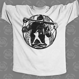 May include: A white t-shirt with a black silhouette of a baseball player holding a bat in front of a baseball. The player is facing away from the viewer.