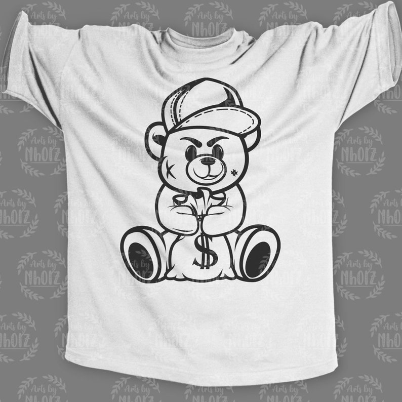 May include: A white t-shirt featuring a black and white illustration of a teddy bear wearing a baseball cap and holding a bag of money.