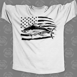 May include: A white t-shirt with a black silhouette of a tuna fish jumping over a distressed American flag.
