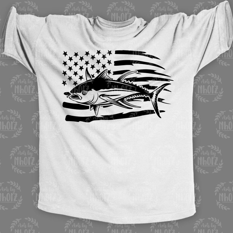 May include: A white t-shirt with a black silhouette of a tuna fish jumping over a distressed American flag.