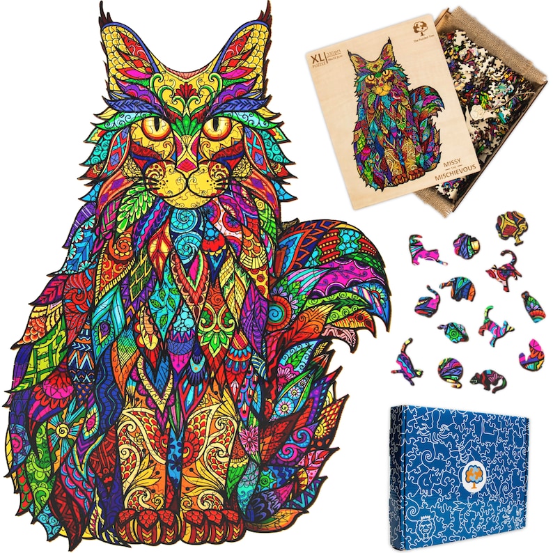 May include: A colorful wooden jigsaw puzzle of a Maine Coon cat with intricate patterns and details. The puzzle is called "Missy the Mischievous" and is part of the XL Jigsaw collection.