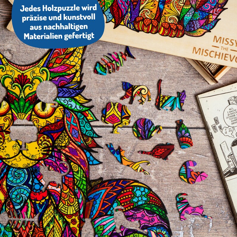May include: A colorful wooden jigsaw puzzle of a cat with intricate patterns. The puzzle pieces are scattered around the main image, which is in a wooden frame. The text "MISSY THE MISCHIEVOUS" is on the box.