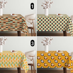 May include: Four different tablecloths with geometric patterns in shades of yellow, orange, brown, green, and blue. The tablecloths are shown on a table with a white background.