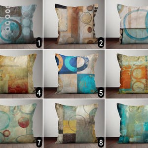 May include: Set of 9 abstract throw pillow covers with geometric patterns in shades of blue, brown, orange, and yellow. The pillows feature circles, squares, and lines.