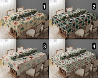 May include: Four different tablecloths with various holiday patterns. The tablecloths are beige with snowflakes, green with a geometric pattern, beige with snowflakes and red accents, and green with a geometric pattern and red accents. Each tablecloth is set with a table setting of plates, silverware, and a centerpiece of greenery.