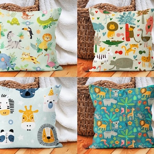 May include: Four different pillow covers with colorful animal illustrations. The pillows are all square and have a white background. The animals include a zebra, a giraffe, a lion, a koala, a penguin, a monkey, a flamingo, a crocodile, a bear, and a hippo.