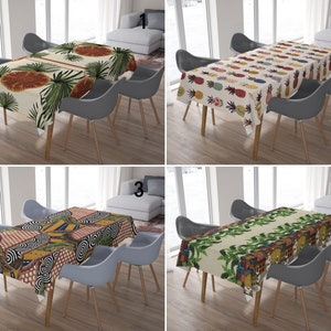 May include: Four different tablecloths with various tropical patterns. The tablecloths are beige with colorful designs of pineapples, palm leaves, and geometric shapes.
