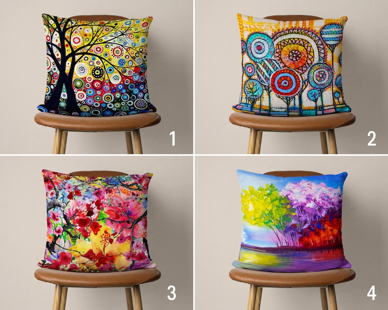 May include: Four colorful throw pillow covers with different abstract floral and tree designs. The pillows are displayed on brown chairs with wooden legs.