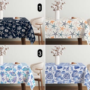 May include: Four different tablecloths with a nautical theme. The tablecloths feature various designs including starfish, seashells, and fish. The tablecloths are all white with different coloured patterns.