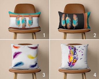 May include: Four different throw pillow designs featuring various feather patterns. The pillows are displayed on brown chairs with a light brown background.