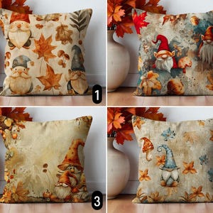May include: Four decorative throw pillows with autumn-themed designs. Each pillow features a different watercolor illustration of gnomes, mushrooms, and fall leaves in shades of orange, brown, and beige. The pillows are square-shaped and appear to be made of a soft fabric.