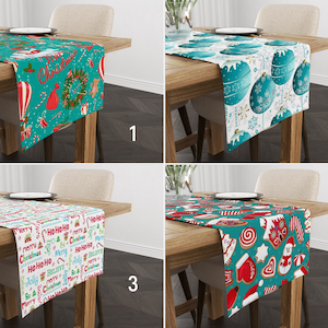 May include: Four different table runners with Christmas themes. The first runner is teal with red and white accents and features a Christmas tree, a hot air balloon, and the words "Merry Christmas". The second runner is white with teal and silver accents and features Christmas ornaments. The third runner is white with red, green, and yellow accents and features the words "Ho Ho Ho" and "Merry Christmas". The fourth runner is teal with red, white, and gold accents and features gingerbread cookies, candy canes, and a snowman.