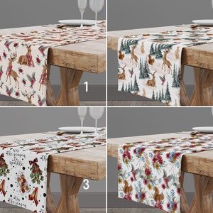 May include: Four different Christmas table runners with various designs. The first runner features a white background with red and green accents and a deer, bird, and floral pattern. The second runner features a white background with green and brown accents and a deer, squirrel, and tree pattern. The third runner features a white background with black polka dots and a red and green Christmas design with the text "Tis the season to sparkle". The fourth runner features a white background with a floral and animal pattern with red, green, and brown accents.