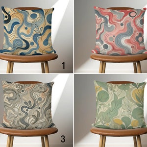 May include: Four different throw pillow designs with abstract patterns. The pillows are on chairs with brown leather seats. The pillows are numbered 1 through 4.