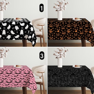 May include: Four different Halloween tablecloths with various spooky designs. The first tablecloth features a black background with white ghosts. The second tablecloth has a black background with orange jack-o'-lanterns. The third tablecloth is pink with black bats. The fourth tablecloth is black with a white spiderweb design.