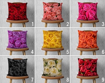 May include: Nine different throw pillow covers with various floral patterns. The pillows feature a variety of colors, including red, pink, purple, yellow, orange, white, and black. The pillows are arranged in three rows of three, with each row featuring a different color scheme.