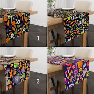 May include: Four different Halloween table runners with various designs featuring candy, pumpkins, and other spooky elements. The runners are black, purple, and black with white text. The text on the runner reads "Trick or Treat".