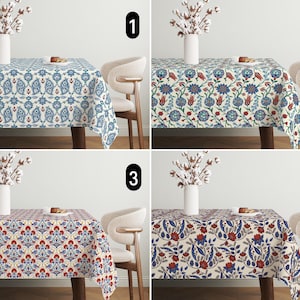 May include: Four rectangular tablecloths with intricate floral and geometric patterns in various color schemes. Each tablecloth is draped over a wooden table, with a vase of white flowers and a small plate of food on top.