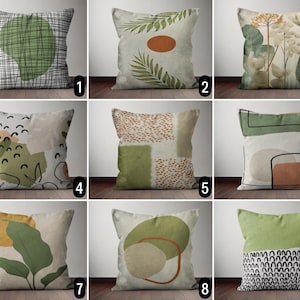 May include: Ten different throw pillow designs featuring abstract patterns in shades of green, brown, white, and black. The pillows are all rectangular and have a white background.