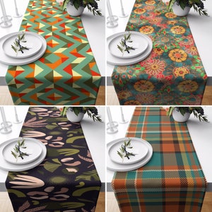 May include: Four different table runners with various patterns. The runners are all approximately 76 cm long and 30 cm wide. The patterns include geometric shapes, floral designs, and plaid.