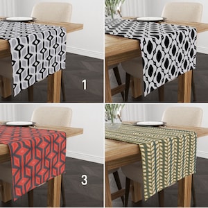 May include: Four different table runners with geometric patterns. The runners are shown on wooden tables with chairs. The patterns are black and white, black and white, red and black, and green and yellow.