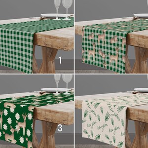 May include: Four different green and white table runners with various patterns. The first runner has a green and white gingham pattern. The second runner has a green and white gingham pattern with a deer and acorn design. The third runner has a green background with white stars and a deer design. The fourth runner has a cream background with a green pine branch and the text "new year" repeated.