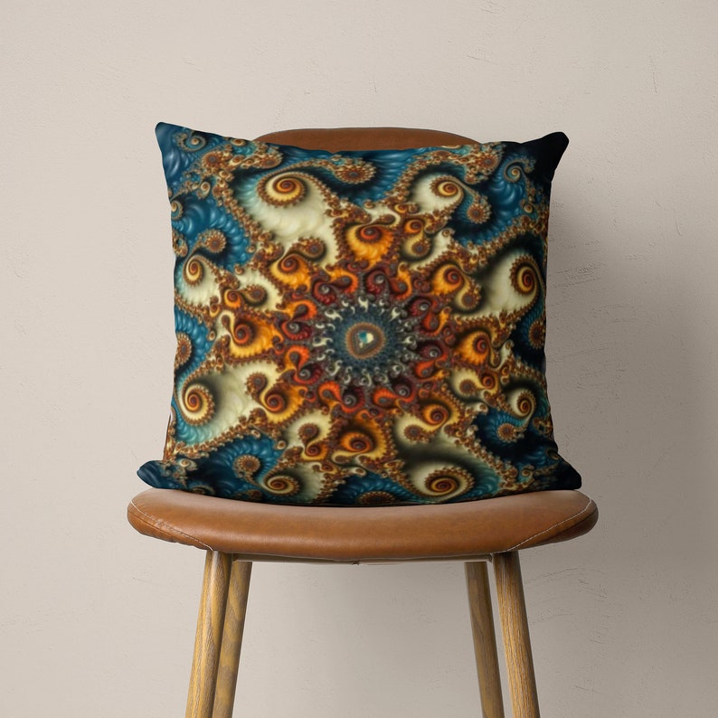 May include: A decorative throw pillow with a colorful, abstract design featuring swirling patterns in shades of blue, orange, and brown. The pillow is sitting on a brown leather chair.